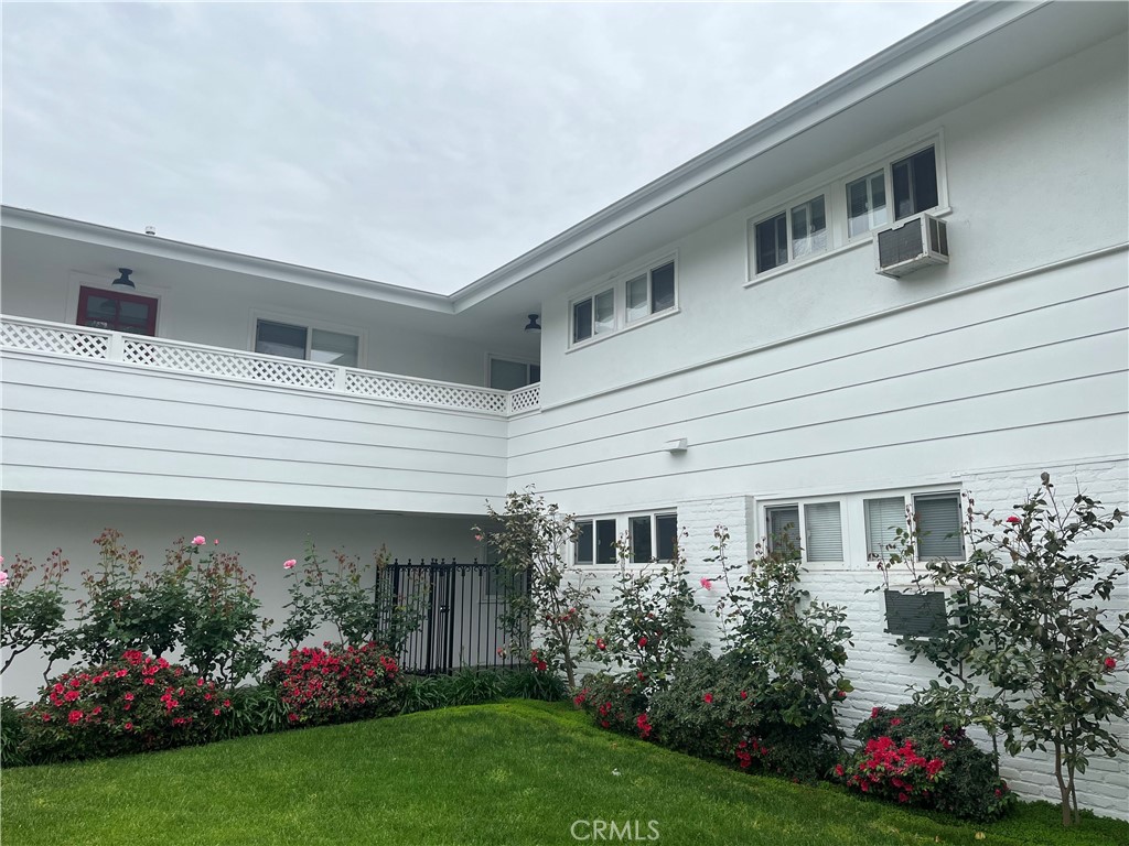 200 Huntington Drive Alhambra, CA 91801 - Photo 1 of 27 a front view of house and a garden