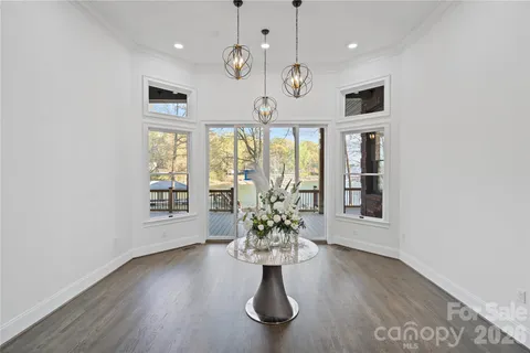 a view of kitchen with furniture and stainless steel appliances