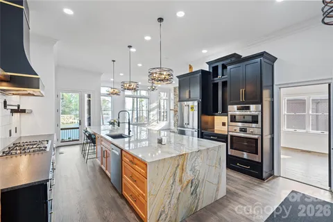 a kitchen with a refrigerator and a stove