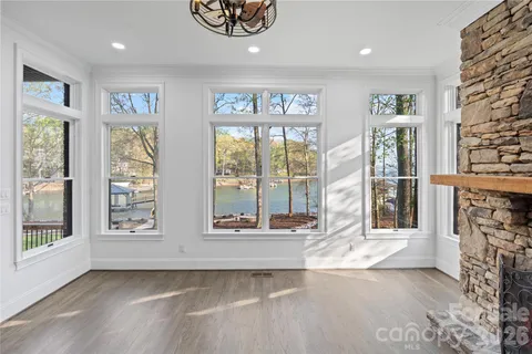 a very nice looking living room with a fireplace and wooden floor