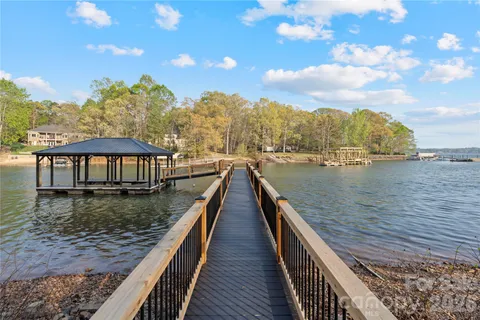 a view of a lake with boats and trees in the background