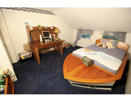 15 Lockeland Road Winchester, MA 01890 - Photo 14 of 24 a bed room with furniture and a wooden floor