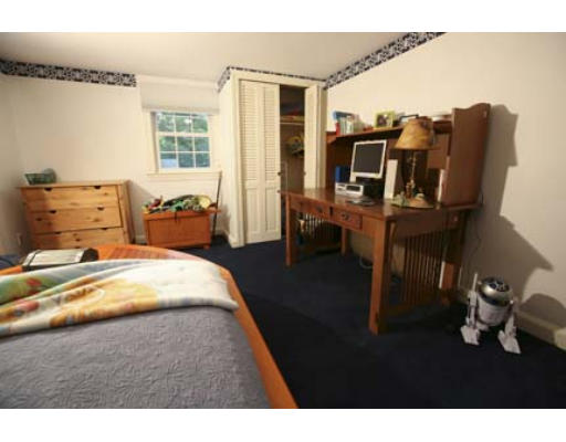15 Lockeland Road Winchester, MA 01890 - Photo 15 of 24 a bedroom with furniture and a window