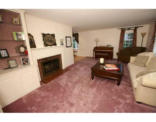 15 Lockeland Road Winchester, MA 01890 - Photo 8 of 24 a living room with furniture and a fireplace