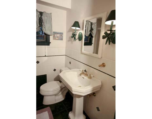 15 Lockeland Road Winchester, MA 01890 - Photo 9 of 24 a bathroom with a sink toilet and mirror
