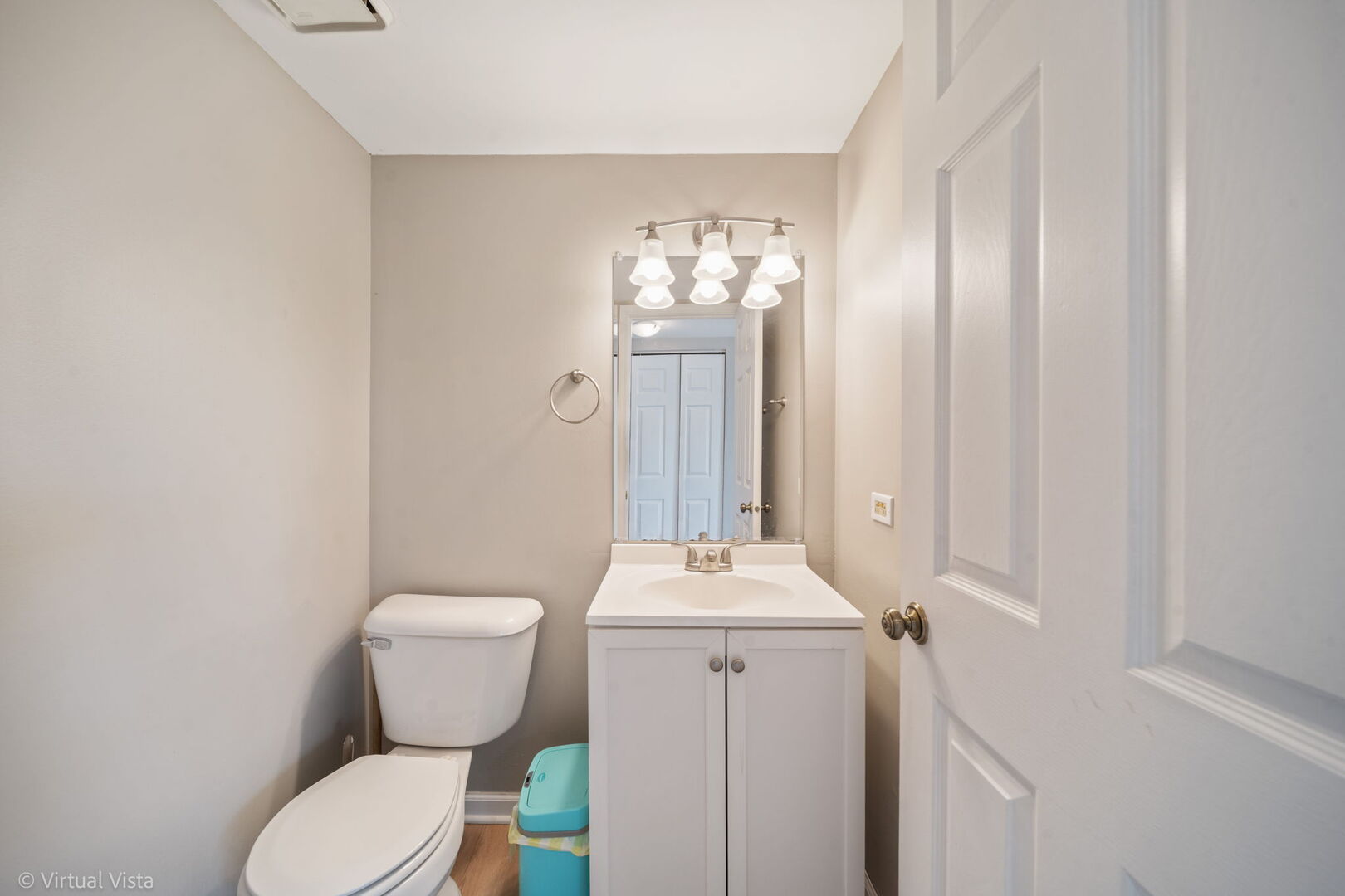 1402 Walnut Circle Carol Stream, IL 60188 - Photo 17 of 26 a bathroom with a toilet sink and mirror