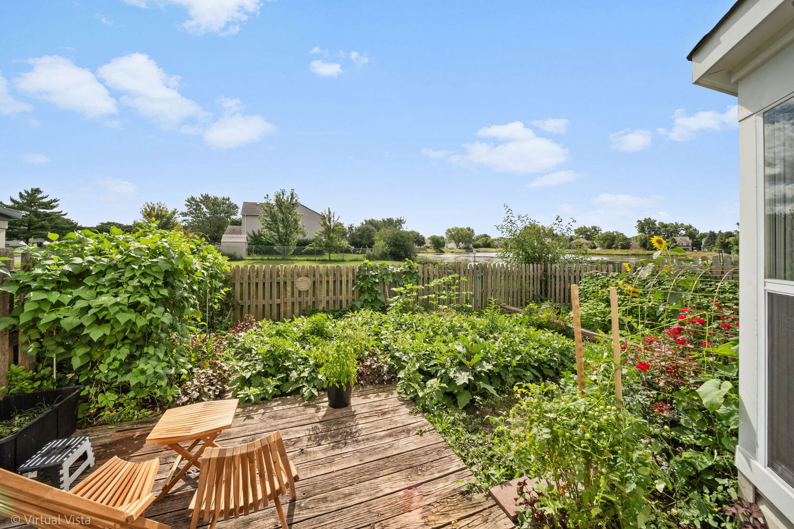1402 Walnut Circle Carol Stream, IL 60188 - Photo 18 of 26 a view of a yard with plants and a fountain