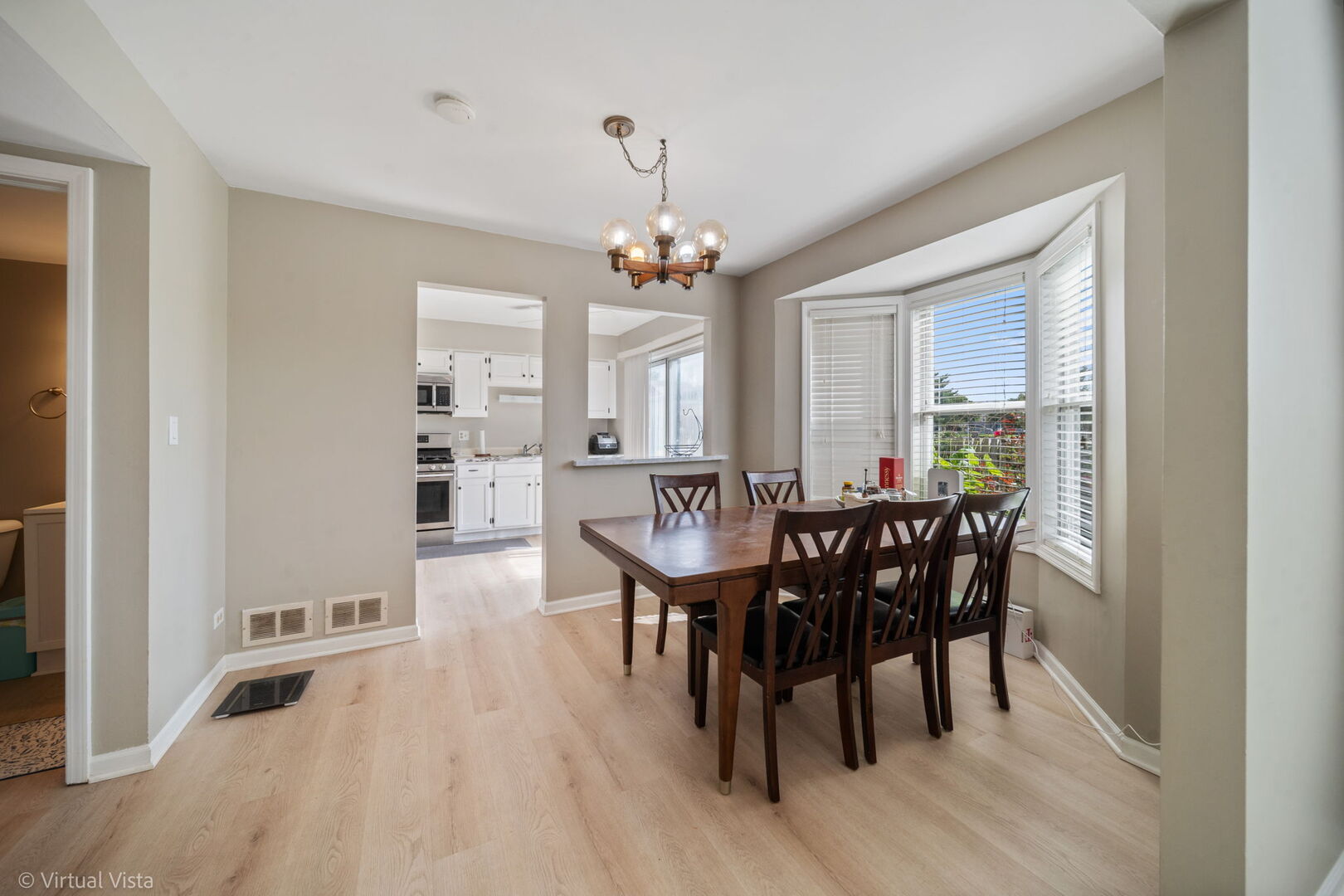 1402 Walnut Circle Carol Stream, IL 60188 - Photo 3 of 26 a view of a dining room with furniture window and wooden floor