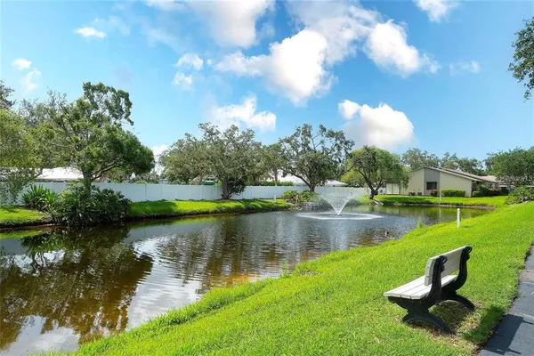 a view of a lake with a yard