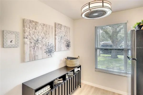 a bathroom with a sink a mirror and a window