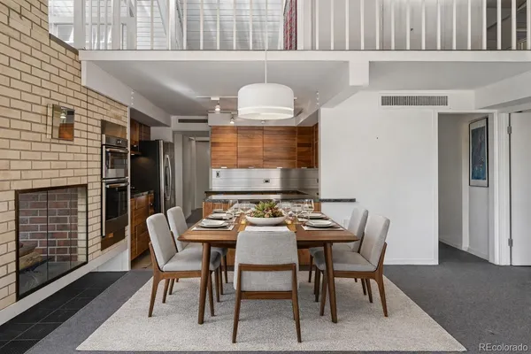 a dining room with furniture and window