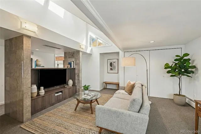 a bed room with a bed and a large window