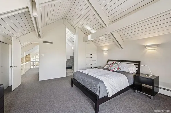 a bathroom with a granite countertop bathtub sink and mirror