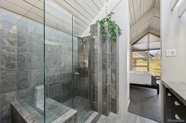 a bathroom with a granite countertop sink mirror and double