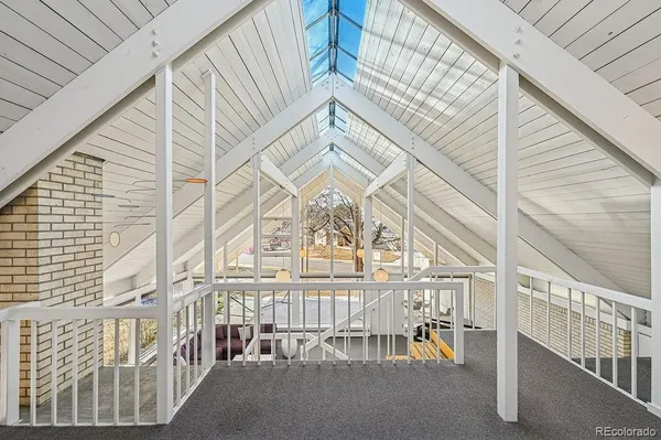 a view of staircase with a rug