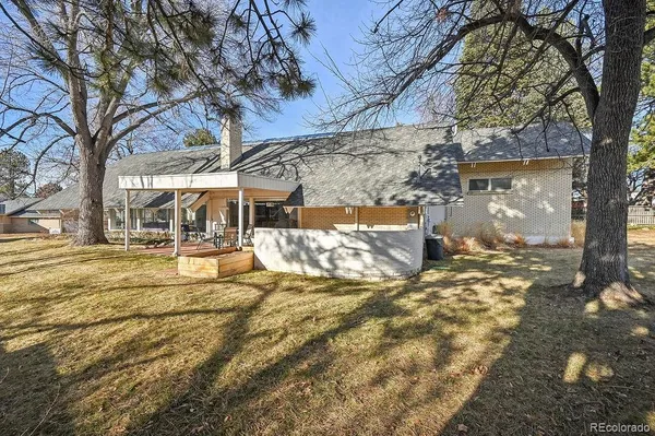a view of a house with a yard covered in snow