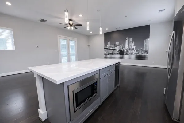 a kitchen with a sink and a refrigerator