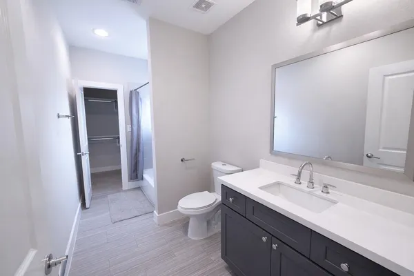 a bathroom with a bathtub and a sink
