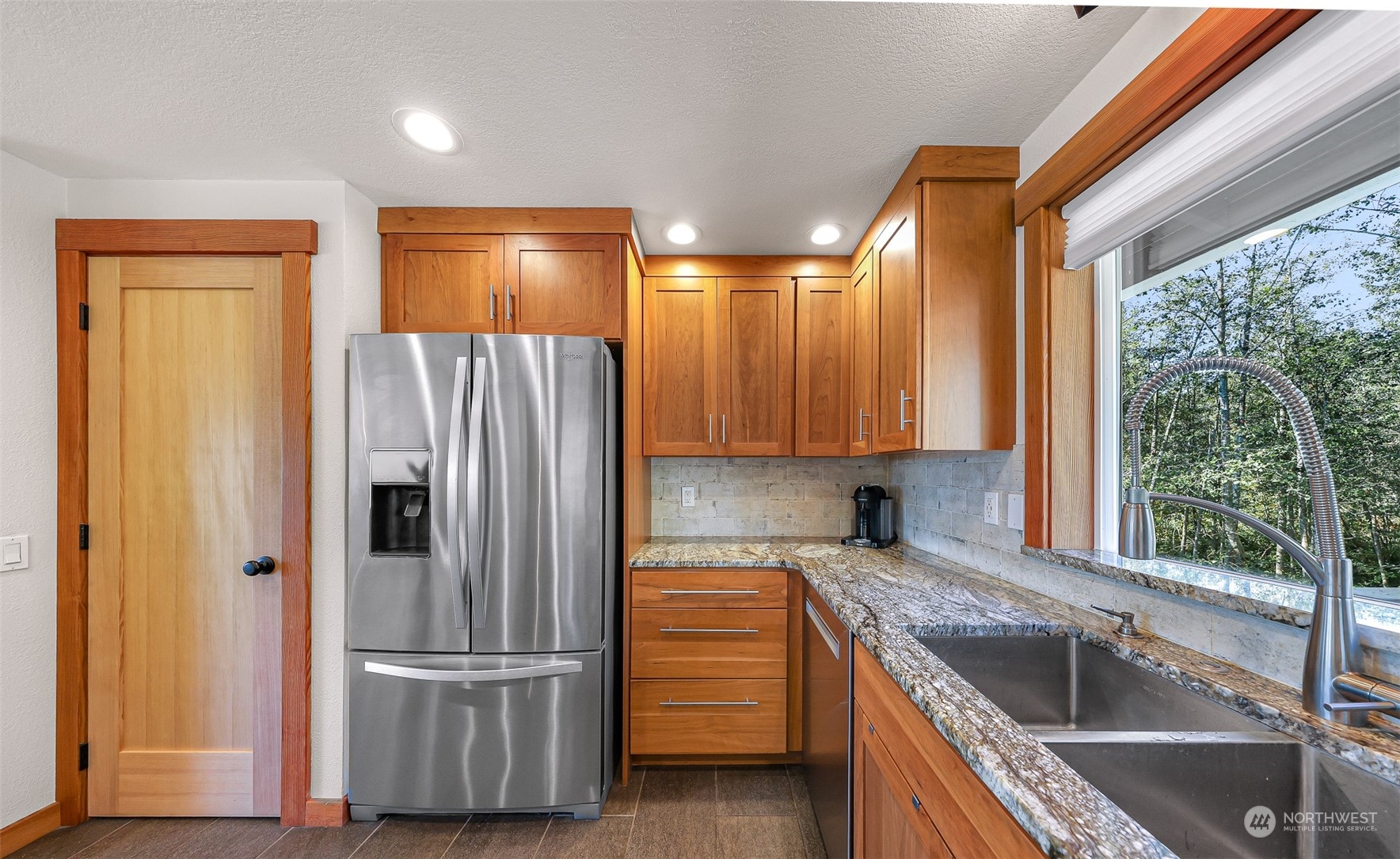 2993 Canlin Drive Ferndale, WA 98248 - Photo 14 of 35 a kitchen with a refrigerator sink and cabinets