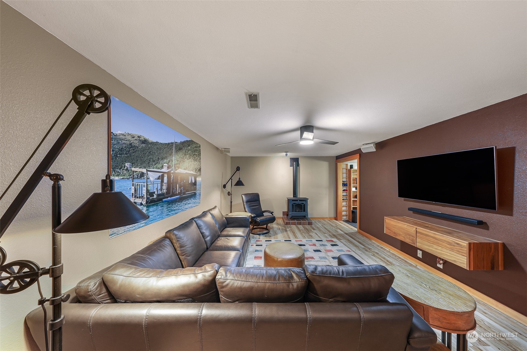 2993 Canlin Drive Ferndale, WA 98248 - Photo 27 of 35 a living room with furniture and a flat screen tv