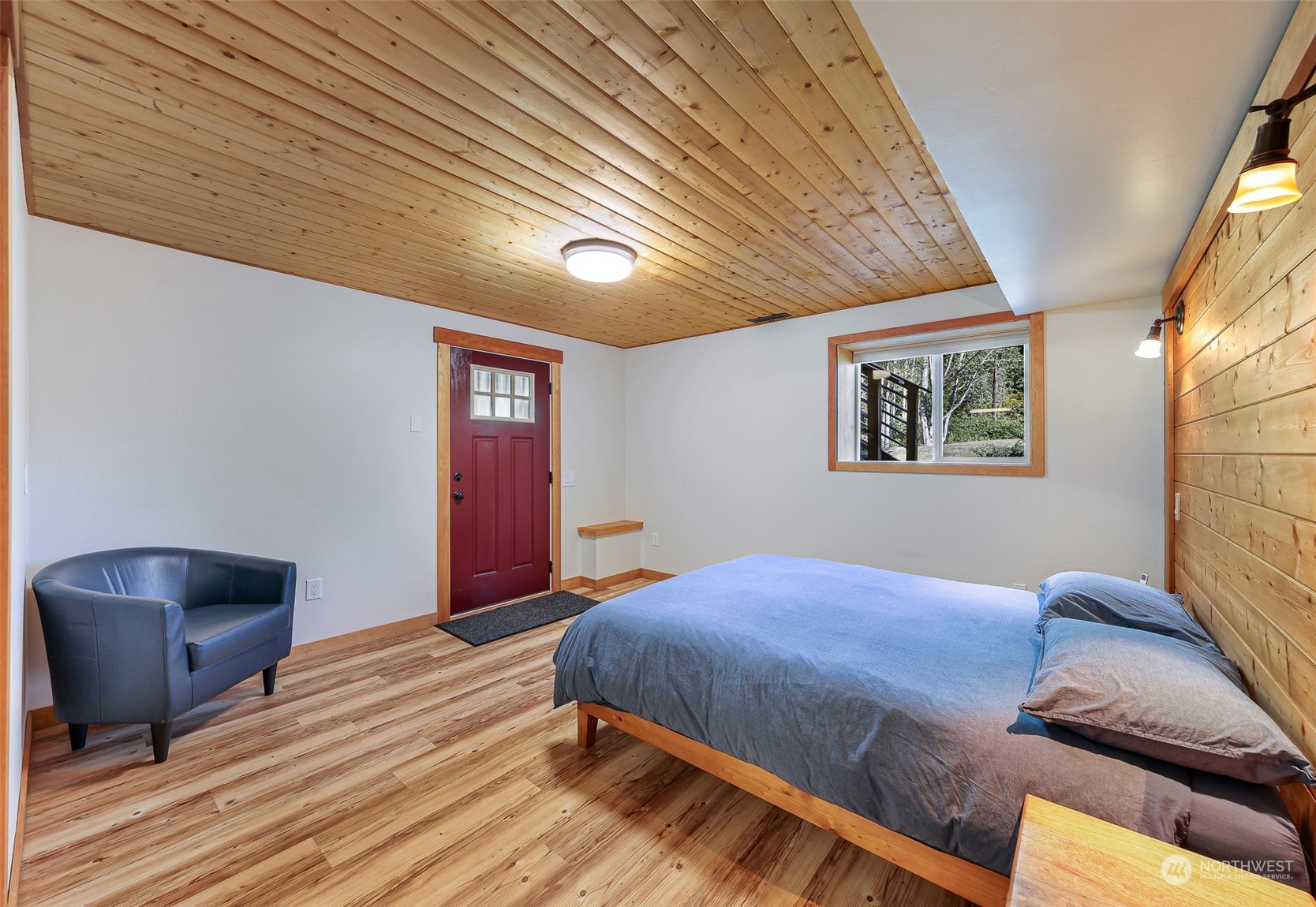 2993 Canlin Drive Ferndale, WA 98248 - Photo 29 of 35 a bedroom with a bed and a chair