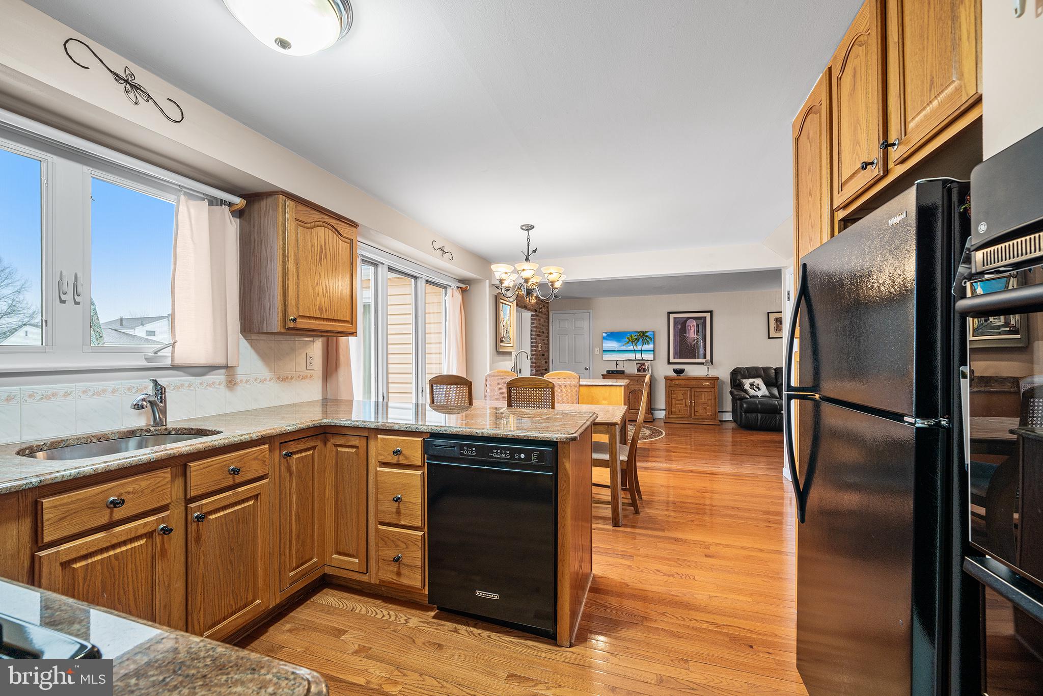 1571 Carousel Drive Warminster, PA 18974 - Photo 11 of 40 a kitchen with stainless steel appliances granite countertop a sink a stove and refrigerator