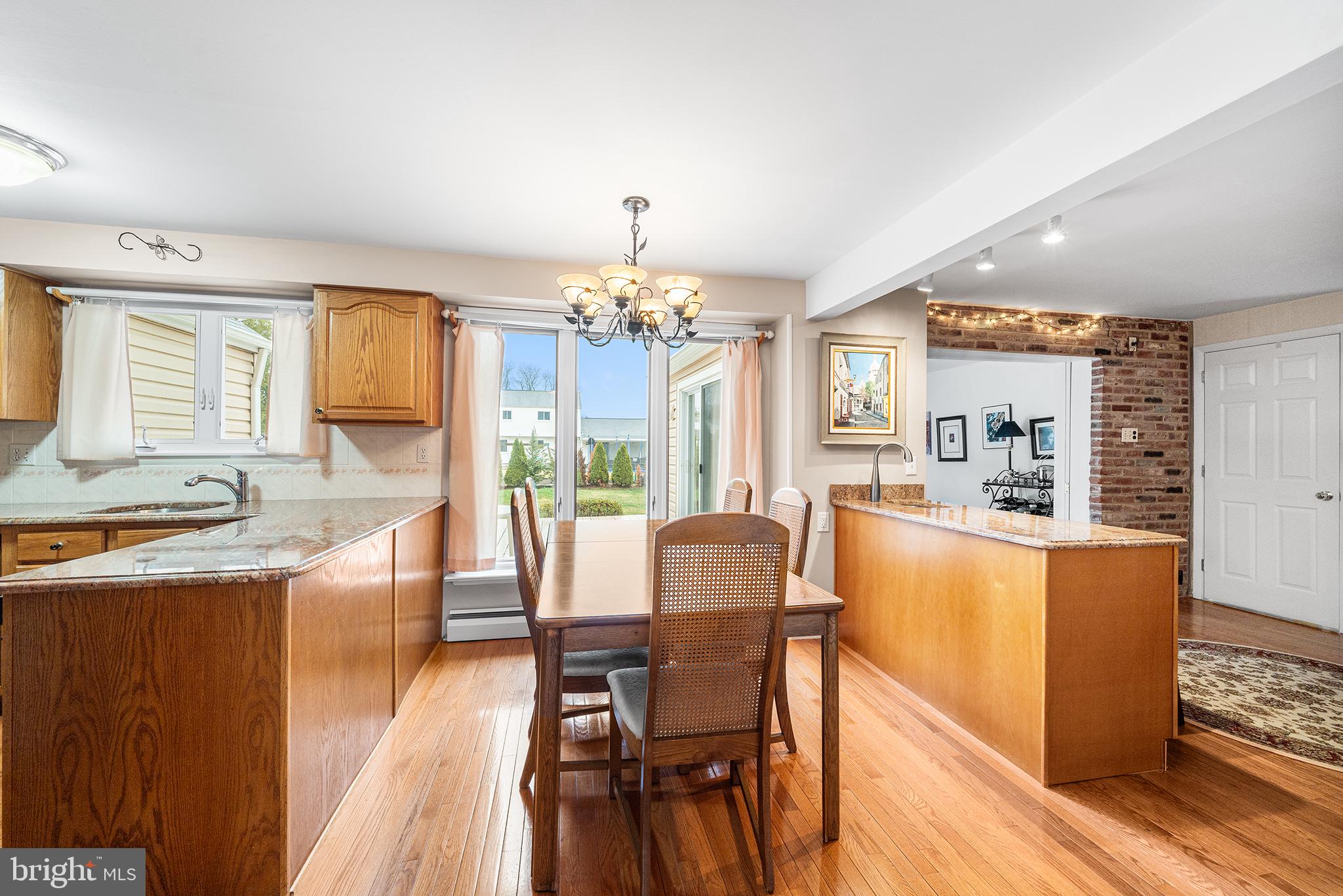 1571 Carousel Drive Warminster, PA 18974 - Photo 14 of 40 a dining room with furniture and wooden floor
