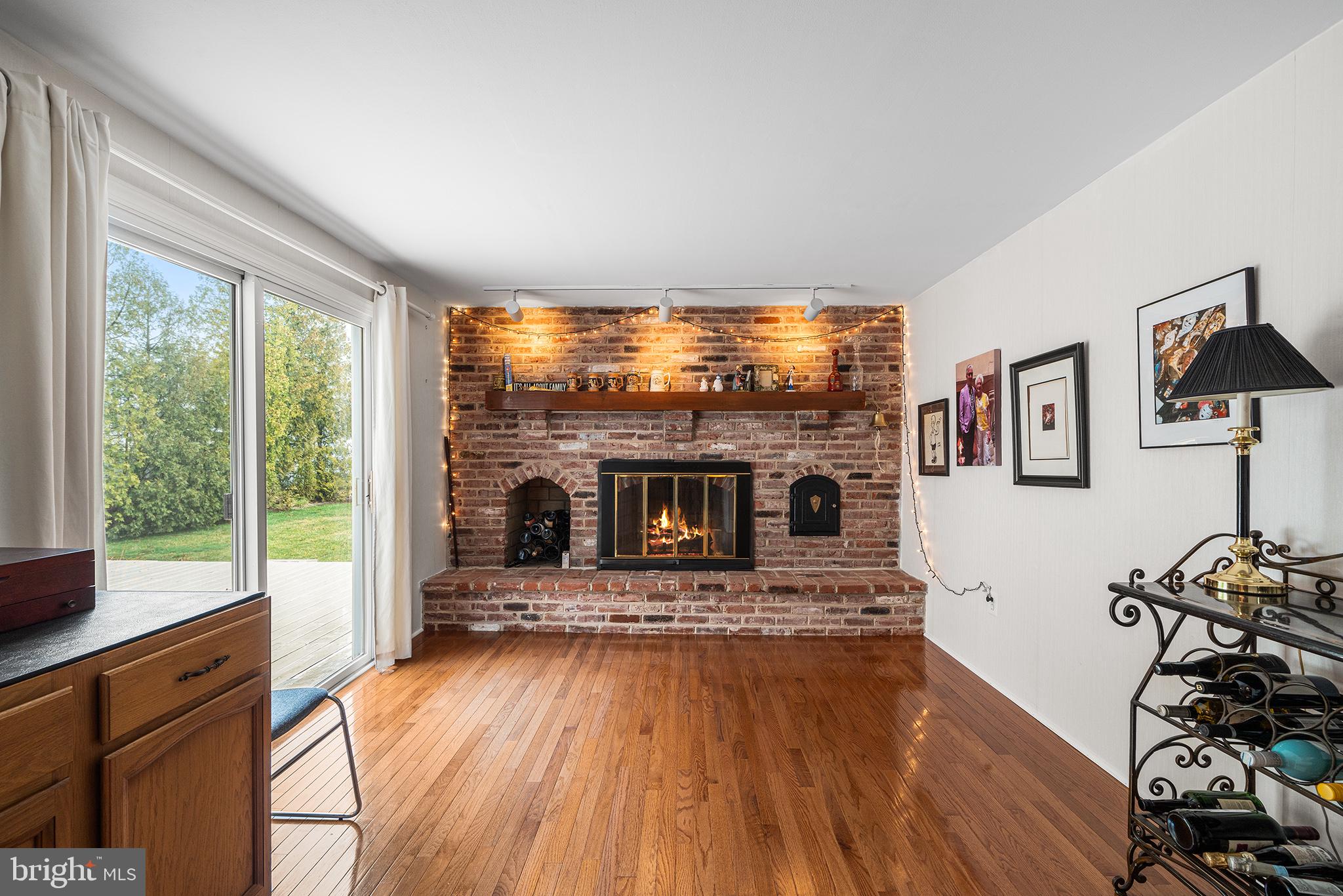 1571 Carousel Drive Warminster, PA 18974 - Photo 19 of 40 a living room with furniture large window and a fireplace
