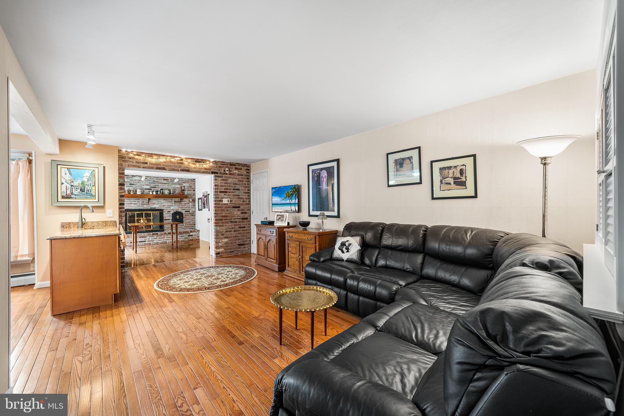 1571 Carousel Drive Warminster, PA 18974 - Photo 21 of 40 a living room with furniture and wooden floor