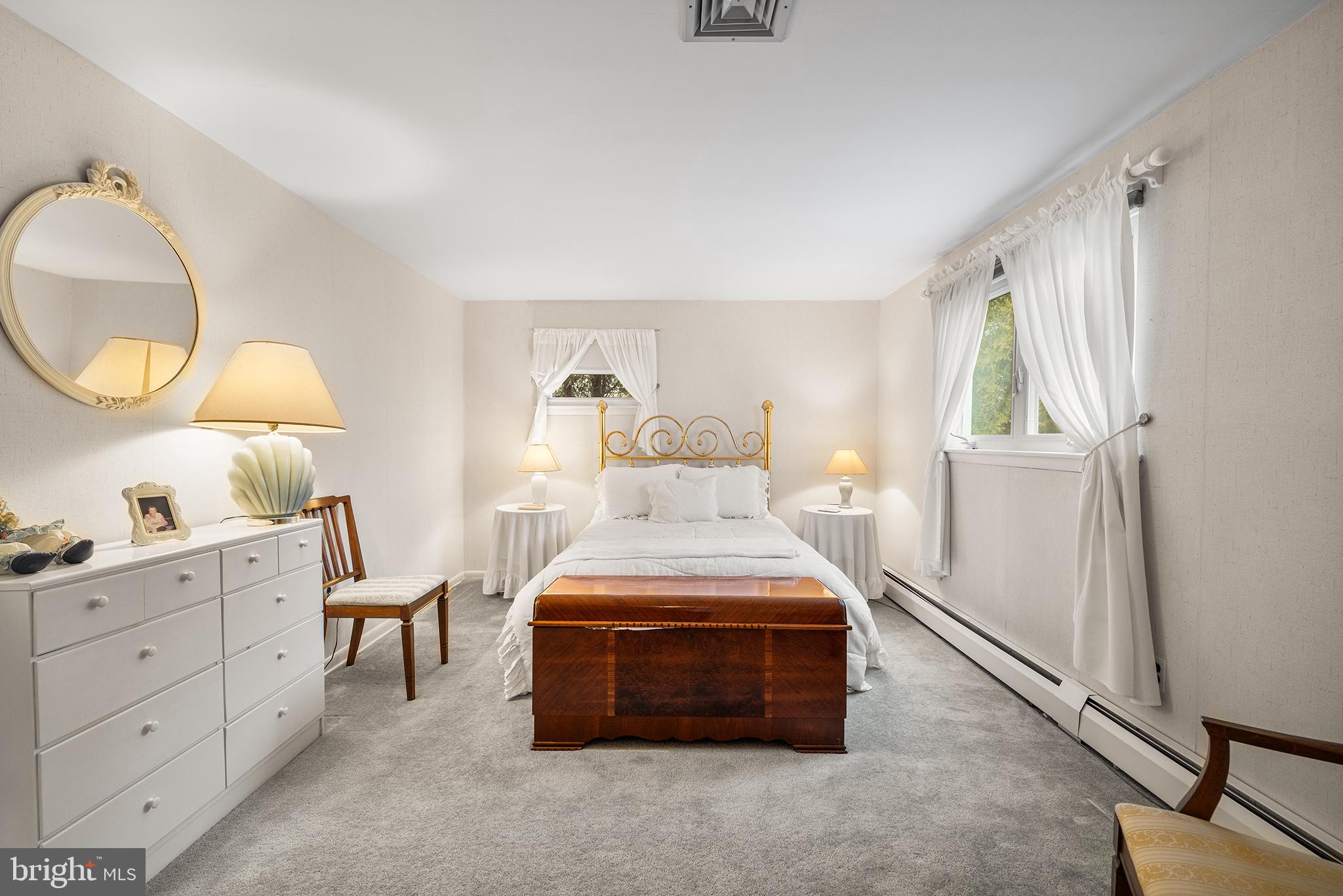 1571 Carousel Drive Warminster, PA 18974 - Photo 22 of 40 a bedroom with a bed and a mirror on the dresser