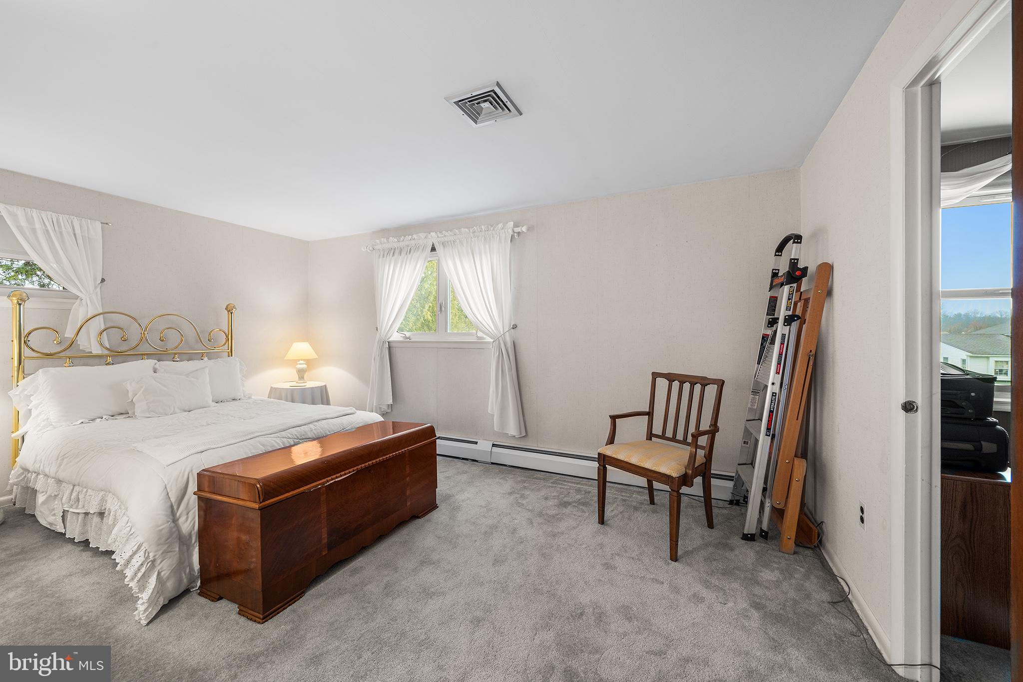 1571 Carousel Drive Warminster, PA 18974 - Photo 23 of 40 a bedroom with a bed and a chair