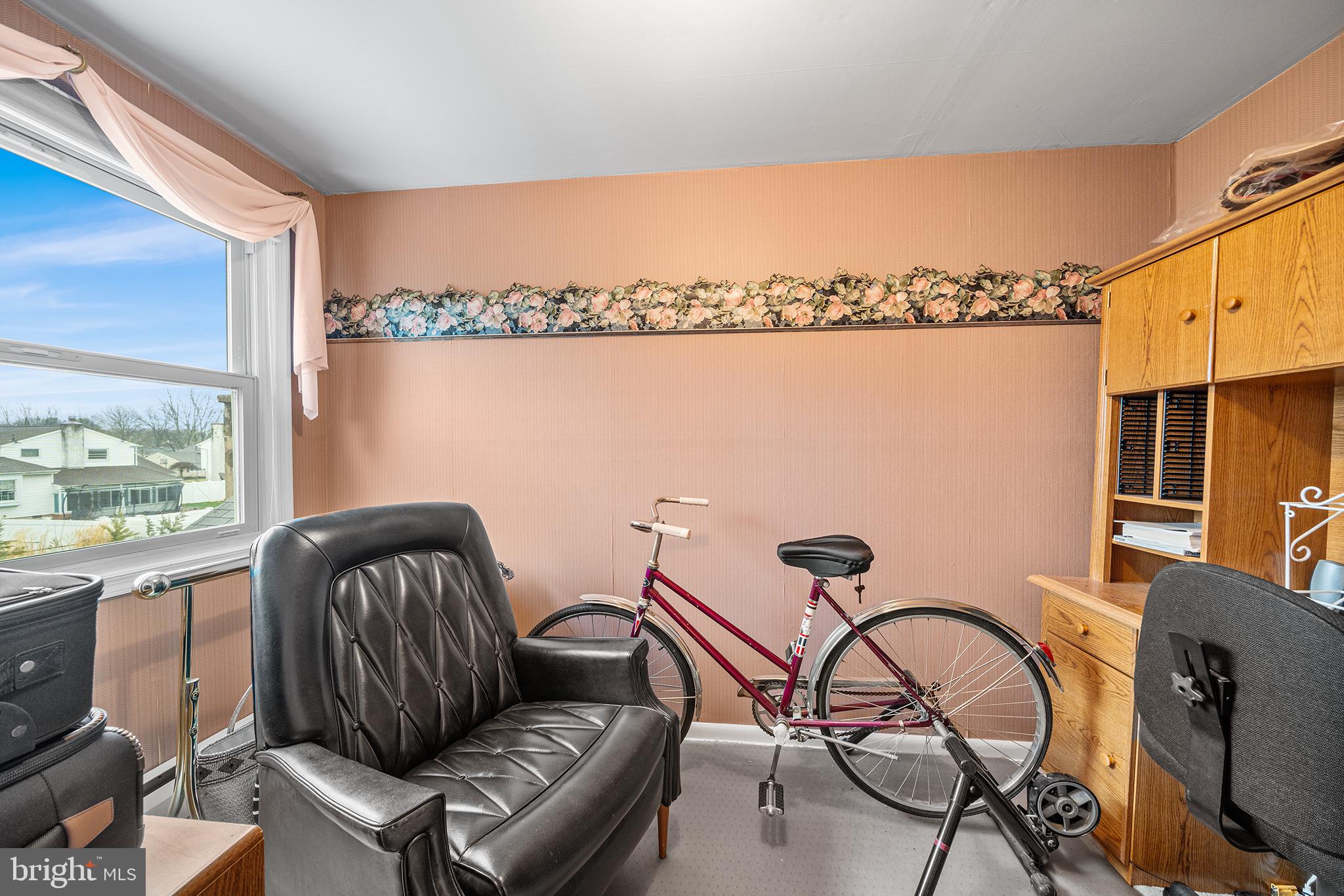1571 Carousel Drive Warminster, PA 18974 - Photo 24 of 40 a living room with furniture a rug and a window