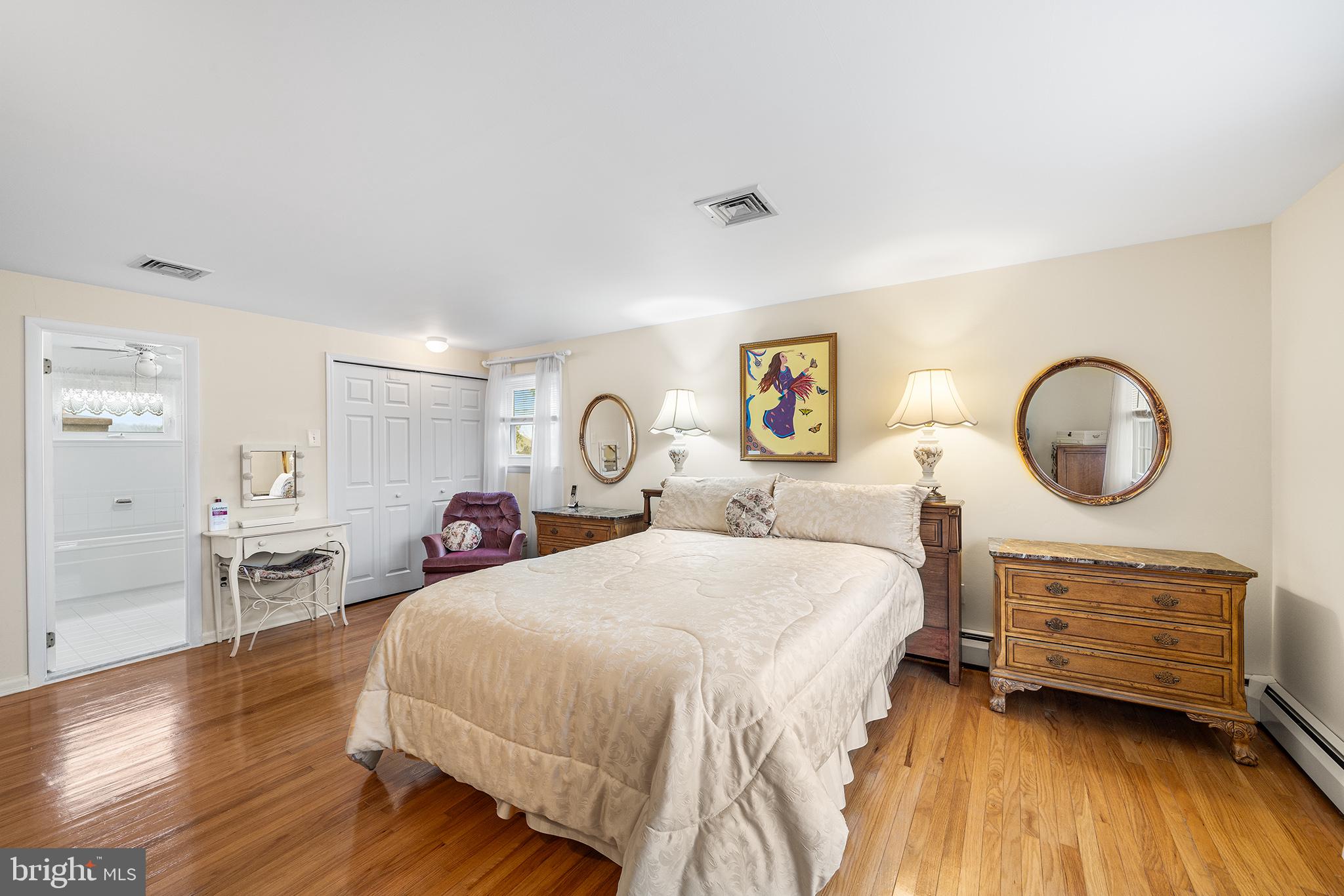 1571 Carousel Drive Warminster, PA 18974 - Photo 29 of 40 a bedroom with a bed and wooden floor