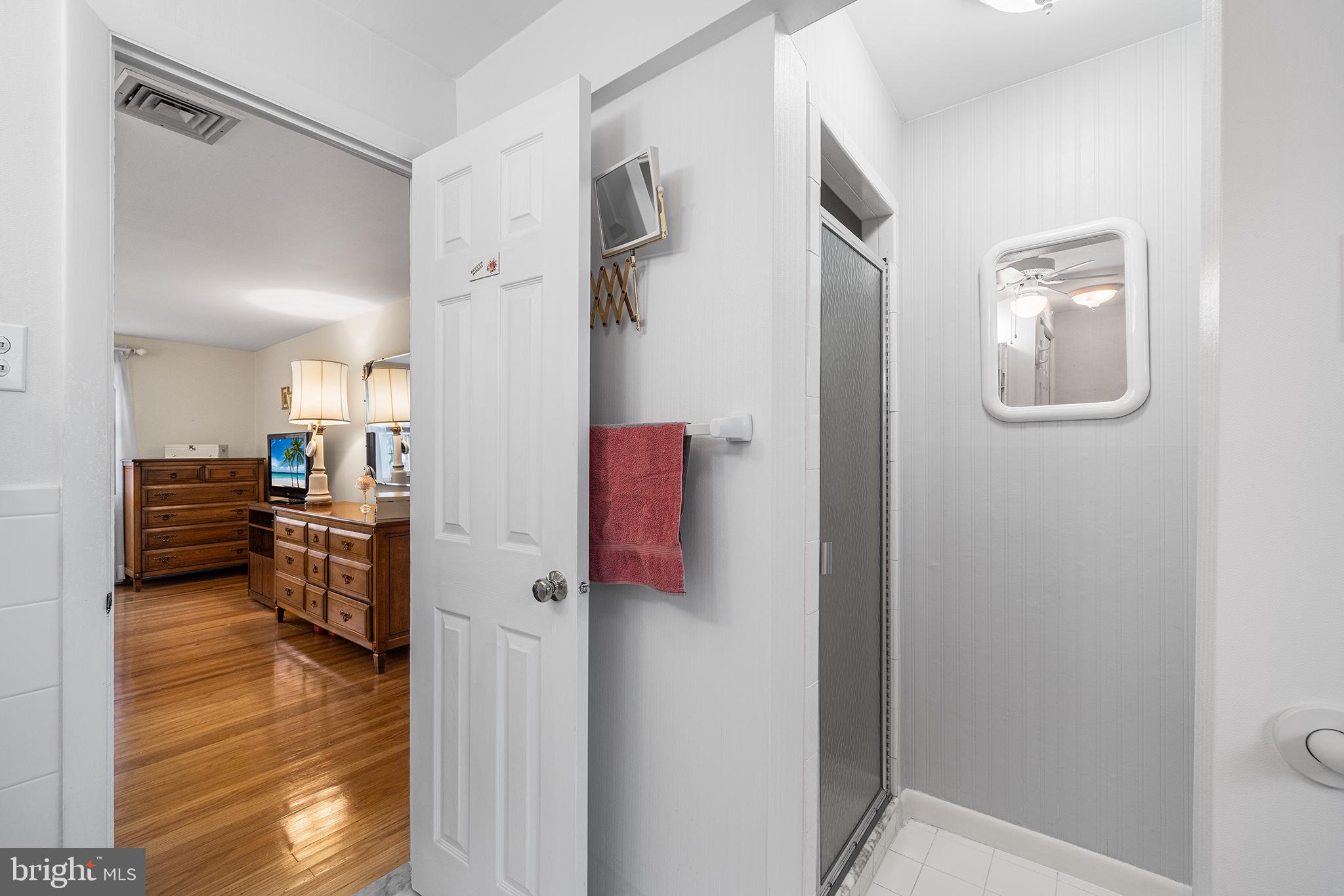 1571 Carousel Drive Warminster, PA 18974 - Photo 33 of 40 a view of a hallway with workspace and wooden floor