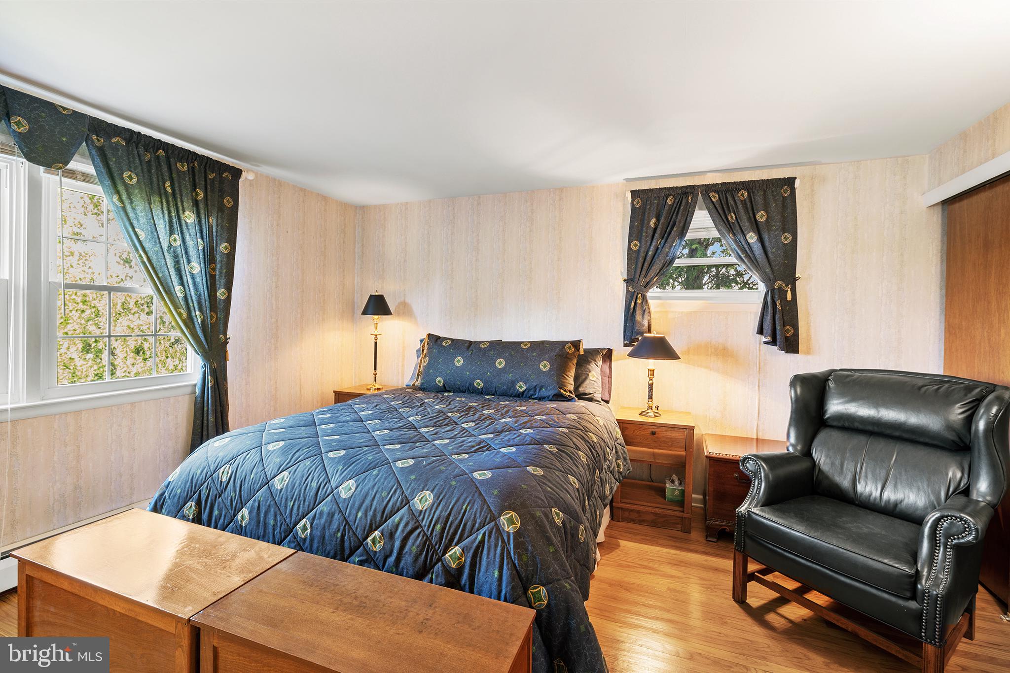 1571 Carousel Drive Warminster, PA 18974 - Photo 35 of 40 a bedroom with a bed and wooden floor