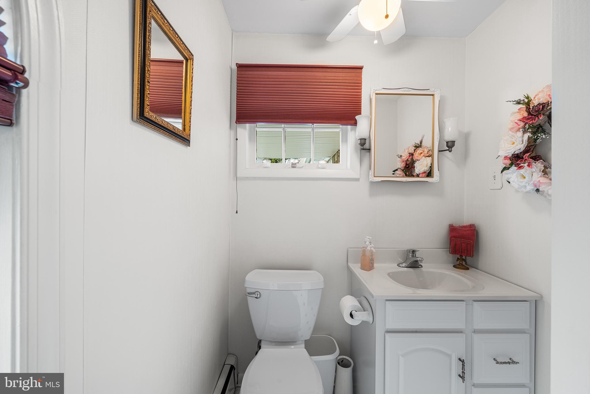 1571 Carousel Drive Warminster, PA 18974 - Photo 7 of 40 a bathroom with a toilet sink and mirror