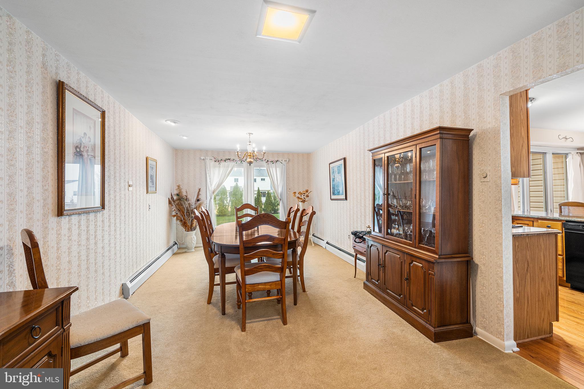 1571 Carousel Drive Warminster, PA 18974 - Photo 10 of 40 a view of a dining room with furniture window and wooden floor