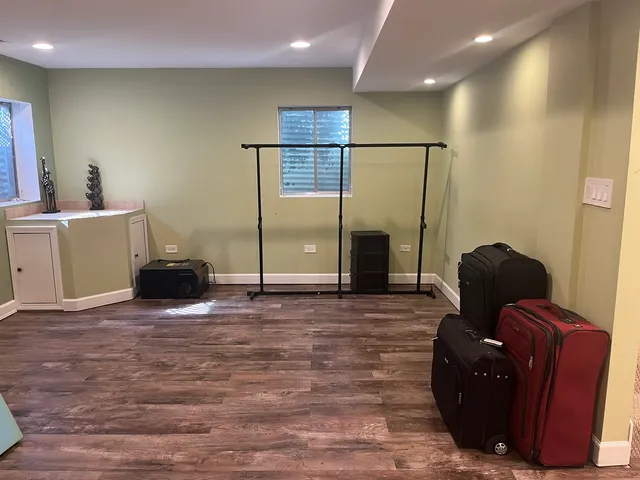 a living room with furniture and a large mirror