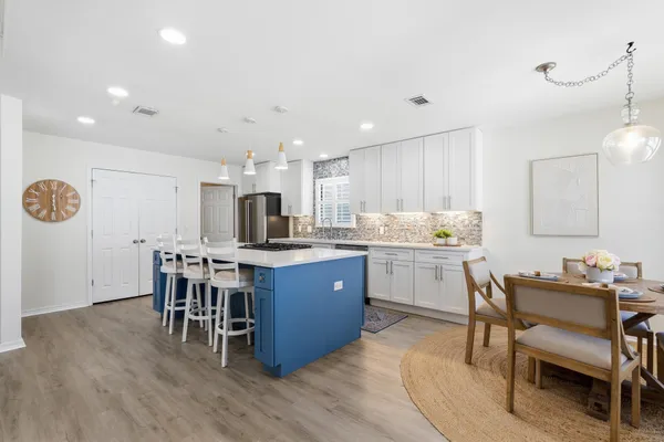 a kitchen with a sink and cabinets