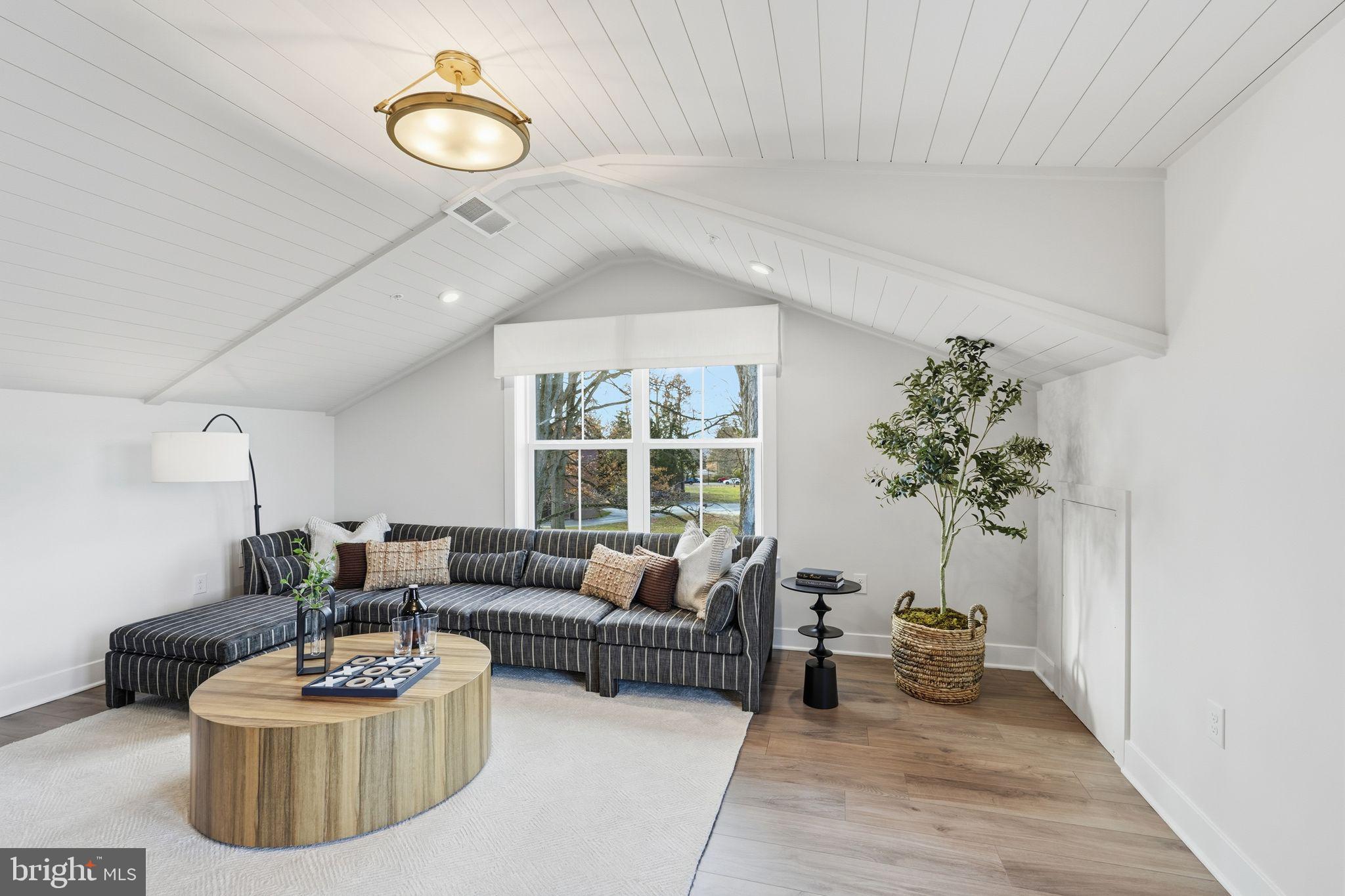 404 Pennybrook Court, Unit 15 Flourtown, PA 19031 - Photo 26 of 31 a living room with furniture potted plant and a window