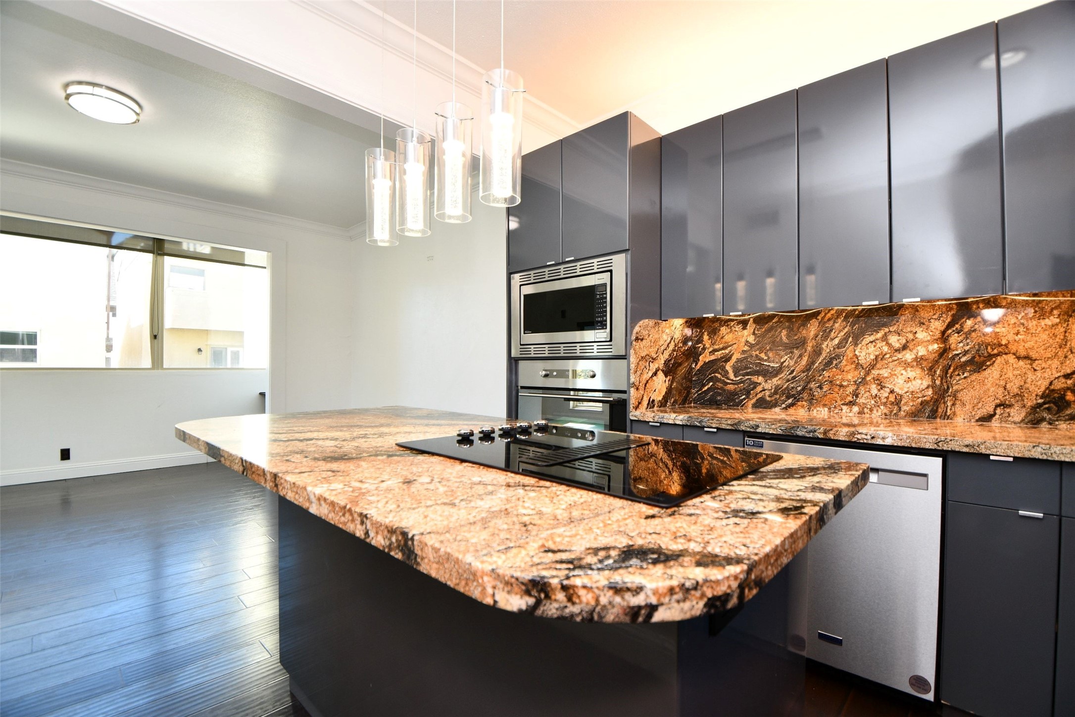 6000 Inwood Drive, Unit 1 Houston, TX 77057 - Photo 15 of 29 a kitchen with kitchen island granite countertop a sink a counter top space and cabinets