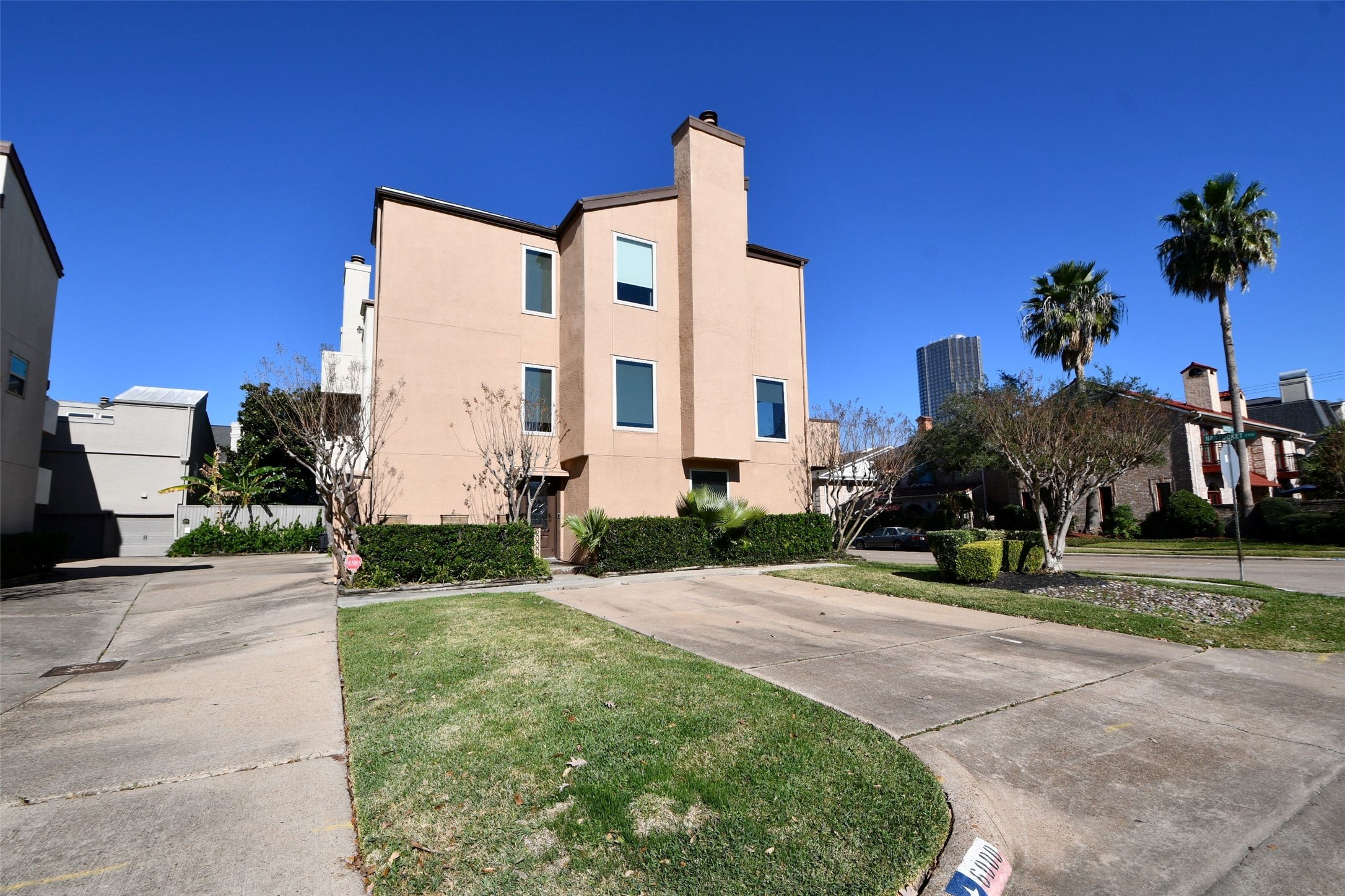6000 Inwood Drive, Unit 1 Houston, TX 77057 - Photo 2 of 29 a front view of multi story residential apartment building with yard and green space