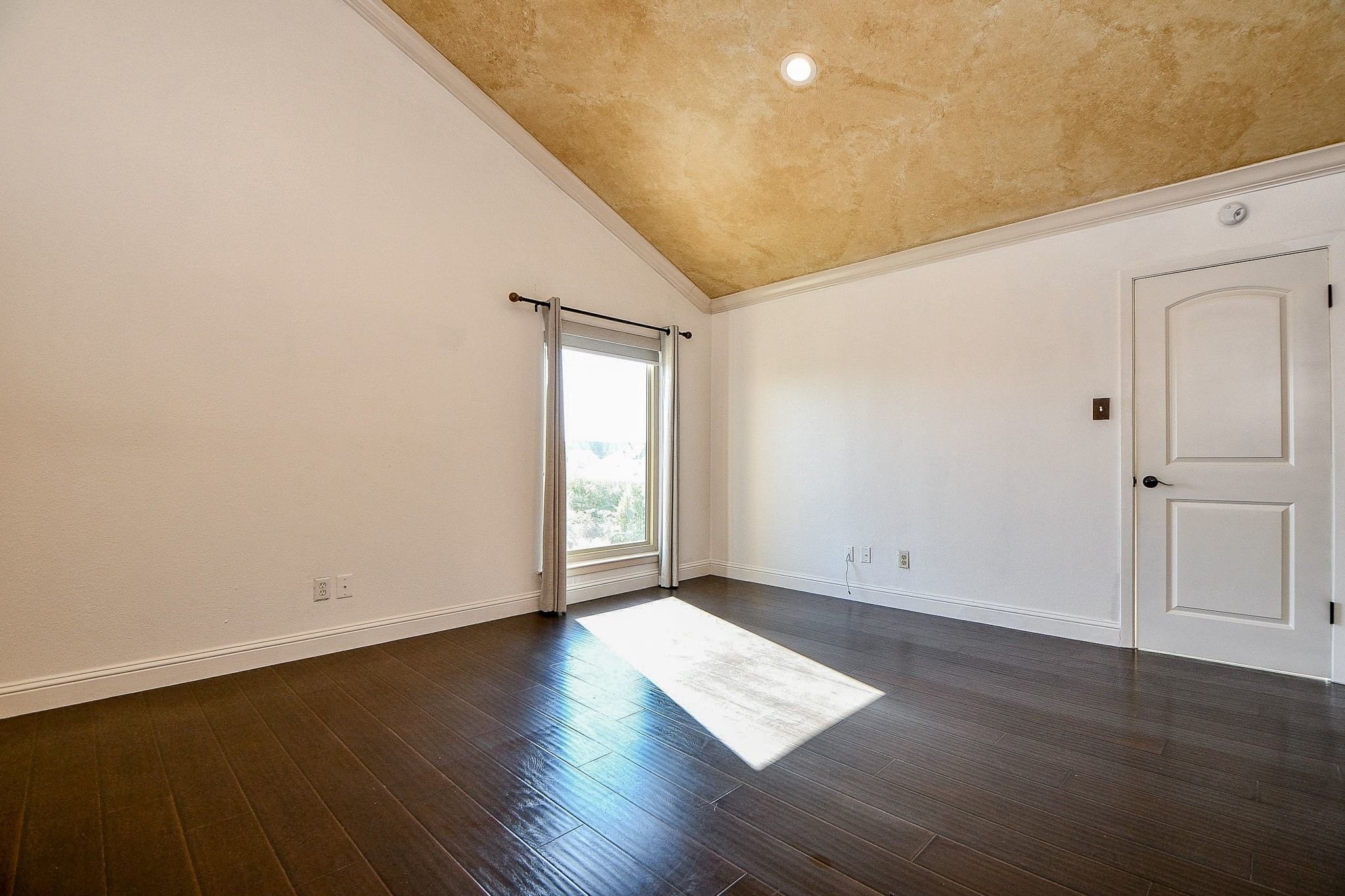 6000 Inwood Drive, Unit 1 Houston, TX 77057 - Photo 21 of 29 an empty room with wooden floor and windows