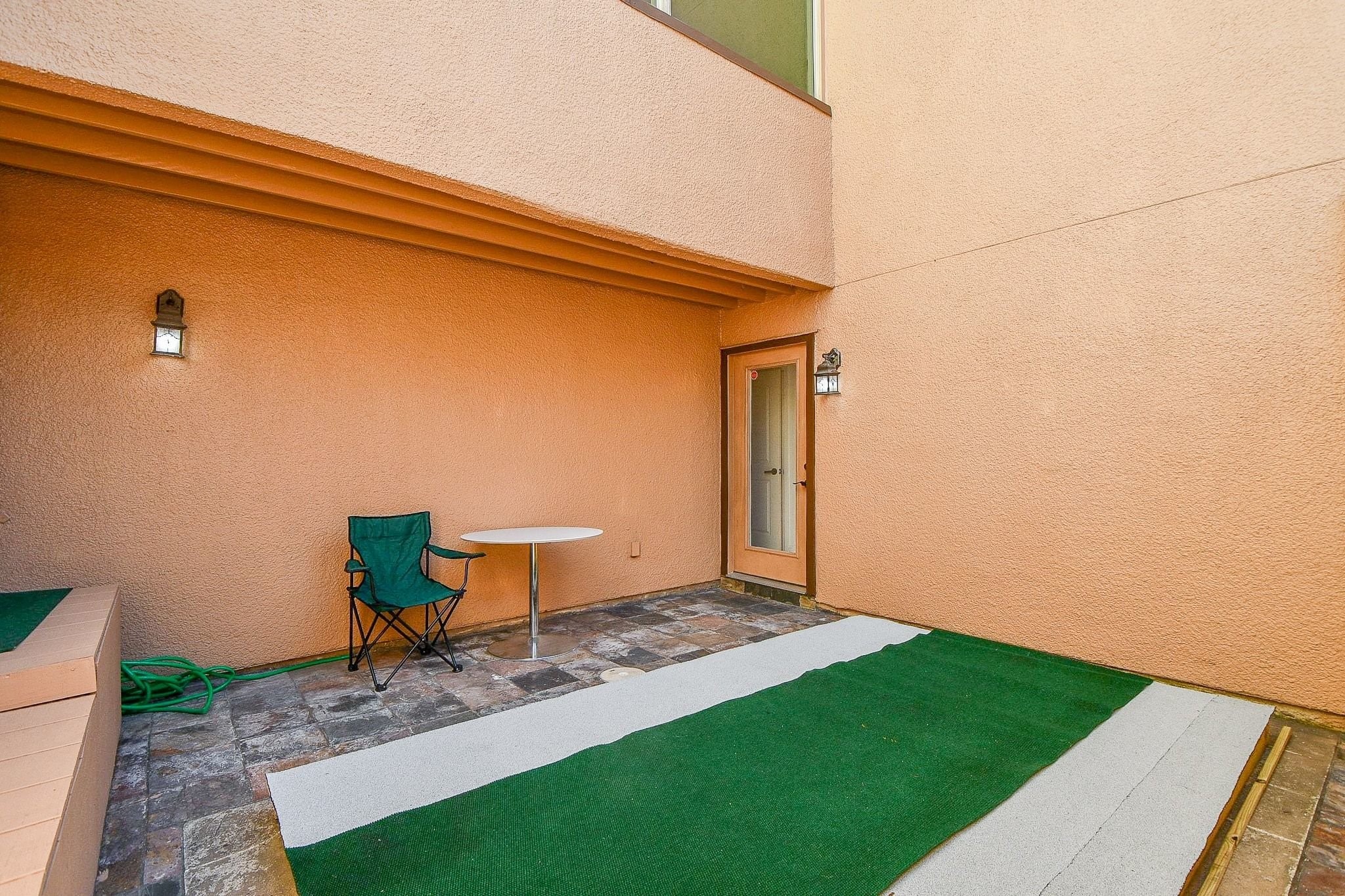 6000 Inwood Drive, Unit 1 Houston, TX 77057 - Photo 26 of 29 a backyard of a house with table and chairs