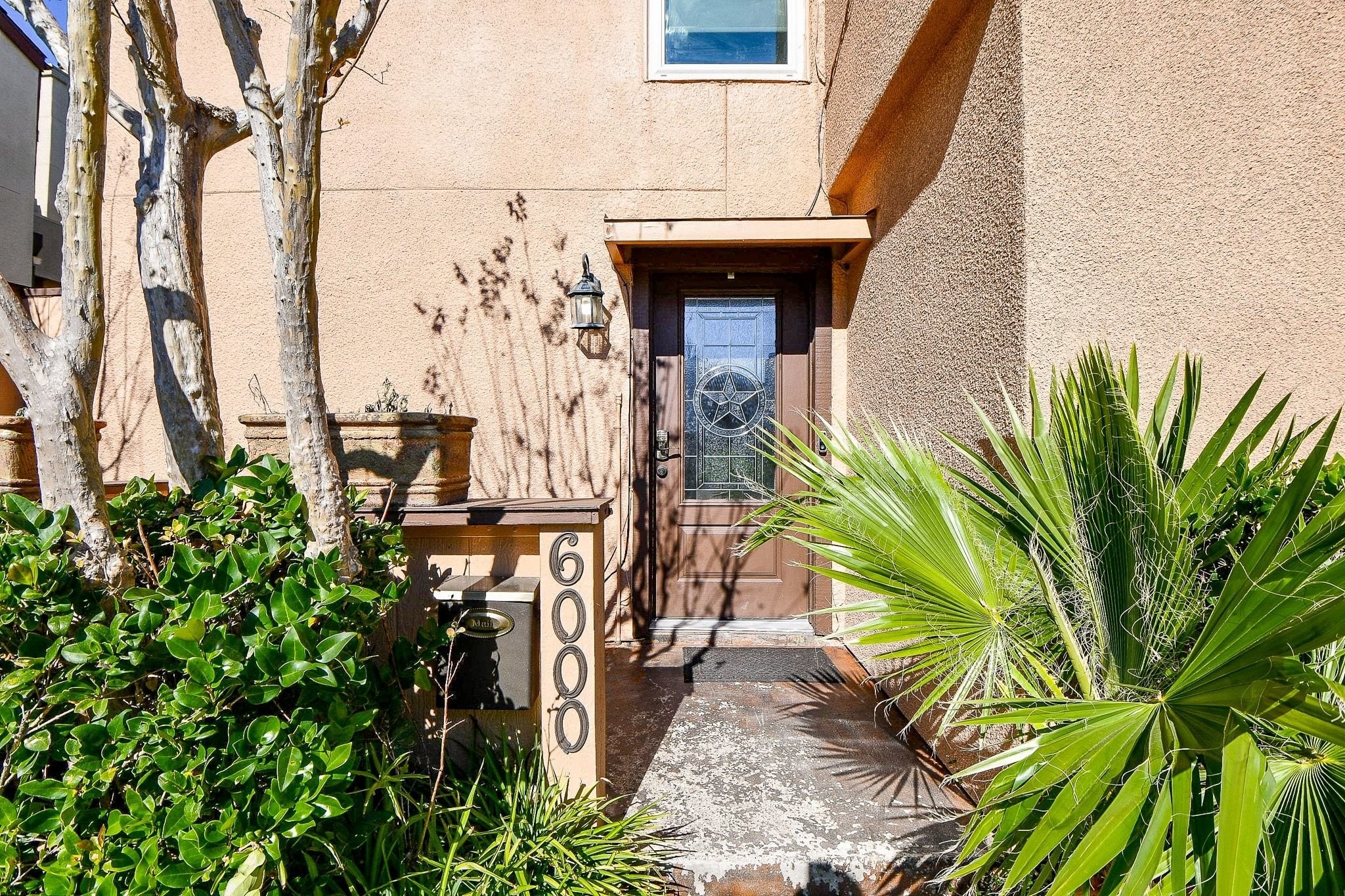 6000 Inwood Drive, Unit 1 Houston, TX 77057 - Photo 4 of 29 a view of a palm tree with an outdoor space
