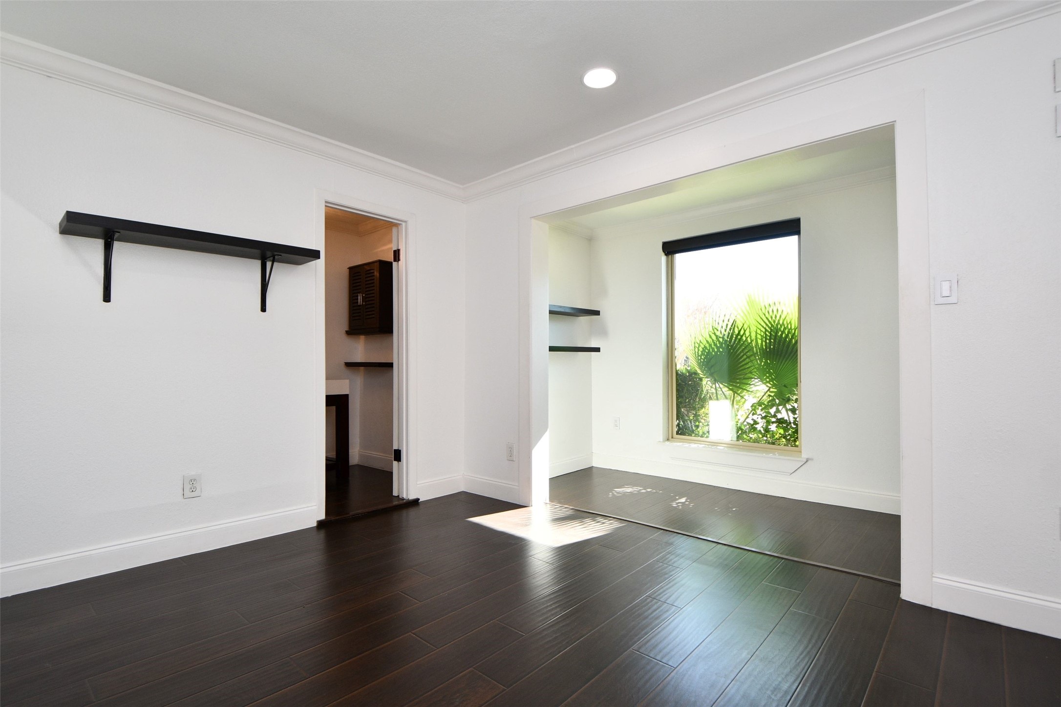6000 Inwood Drive, Unit 1 Houston, TX 77057 - Photo 6 of 29 an empty room with wooden floor and windows