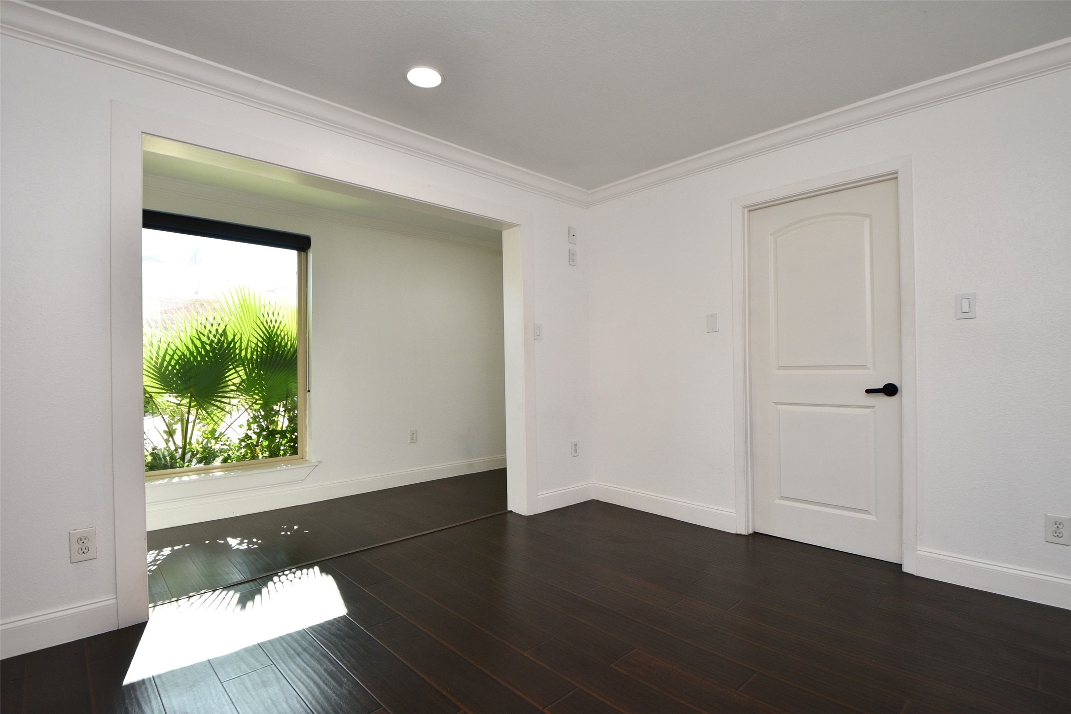 6000 Inwood Drive, Unit 1 Houston, TX 77057 - Photo 7 of 29 an empty room with wooden floor and windows