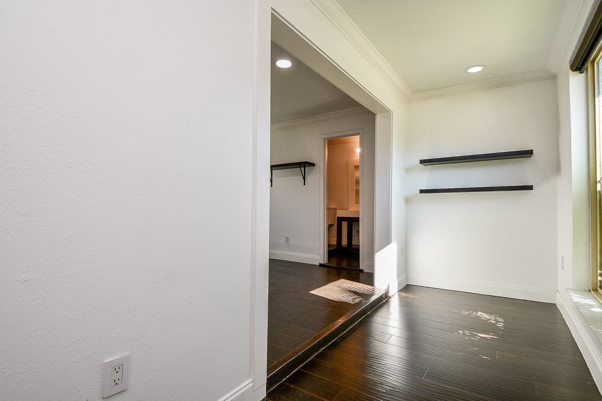 6000 Inwood Drive, Unit 1 Houston, TX 77057 - Photo 8 of 29 a view of a hallway with wooden floor and a cabinet