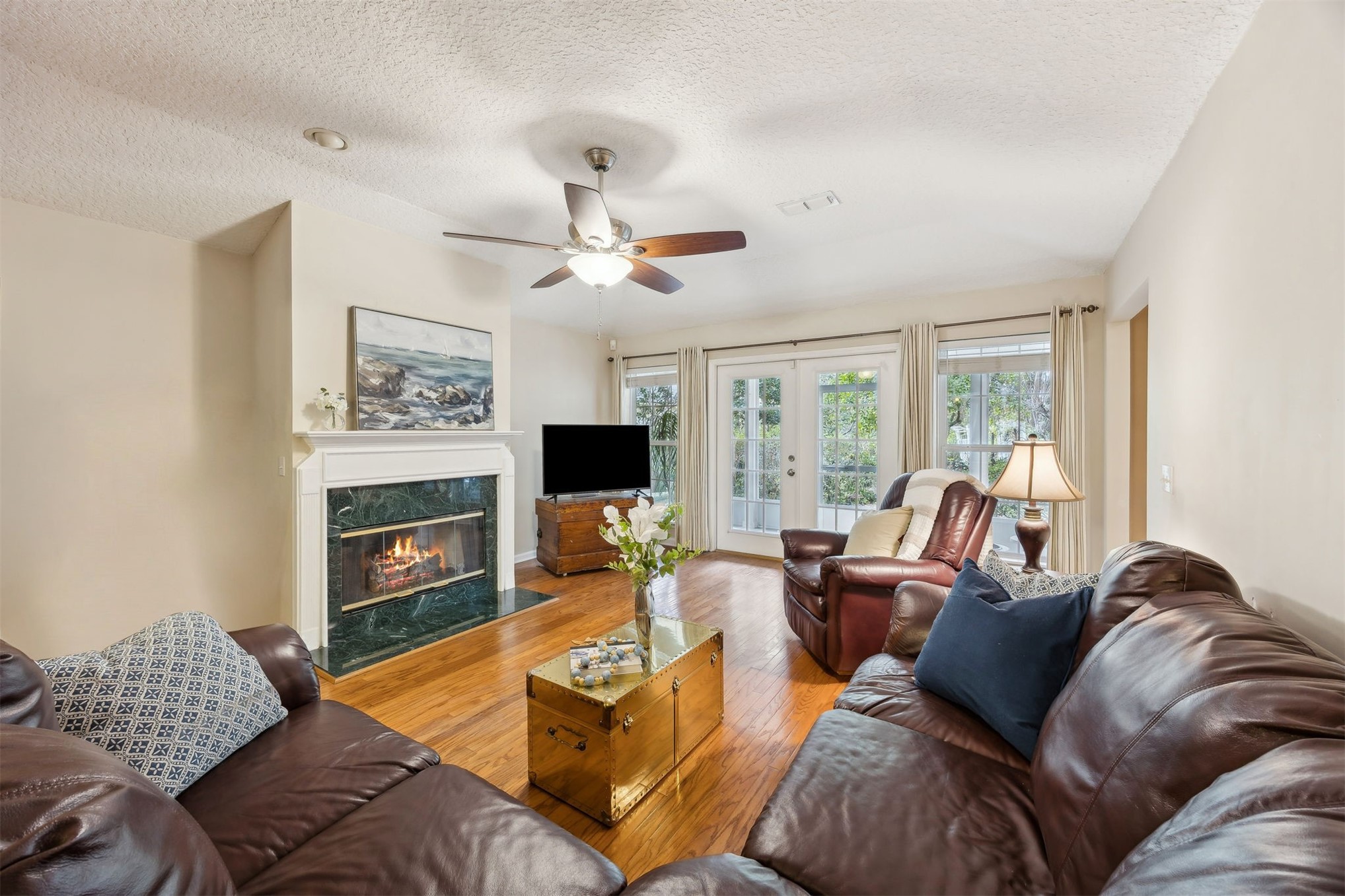 86341 Meadowfield Bluffs Road Yulee, FL 32097 - Photo 13 of 68 a living room with furniture fireplace and a large window