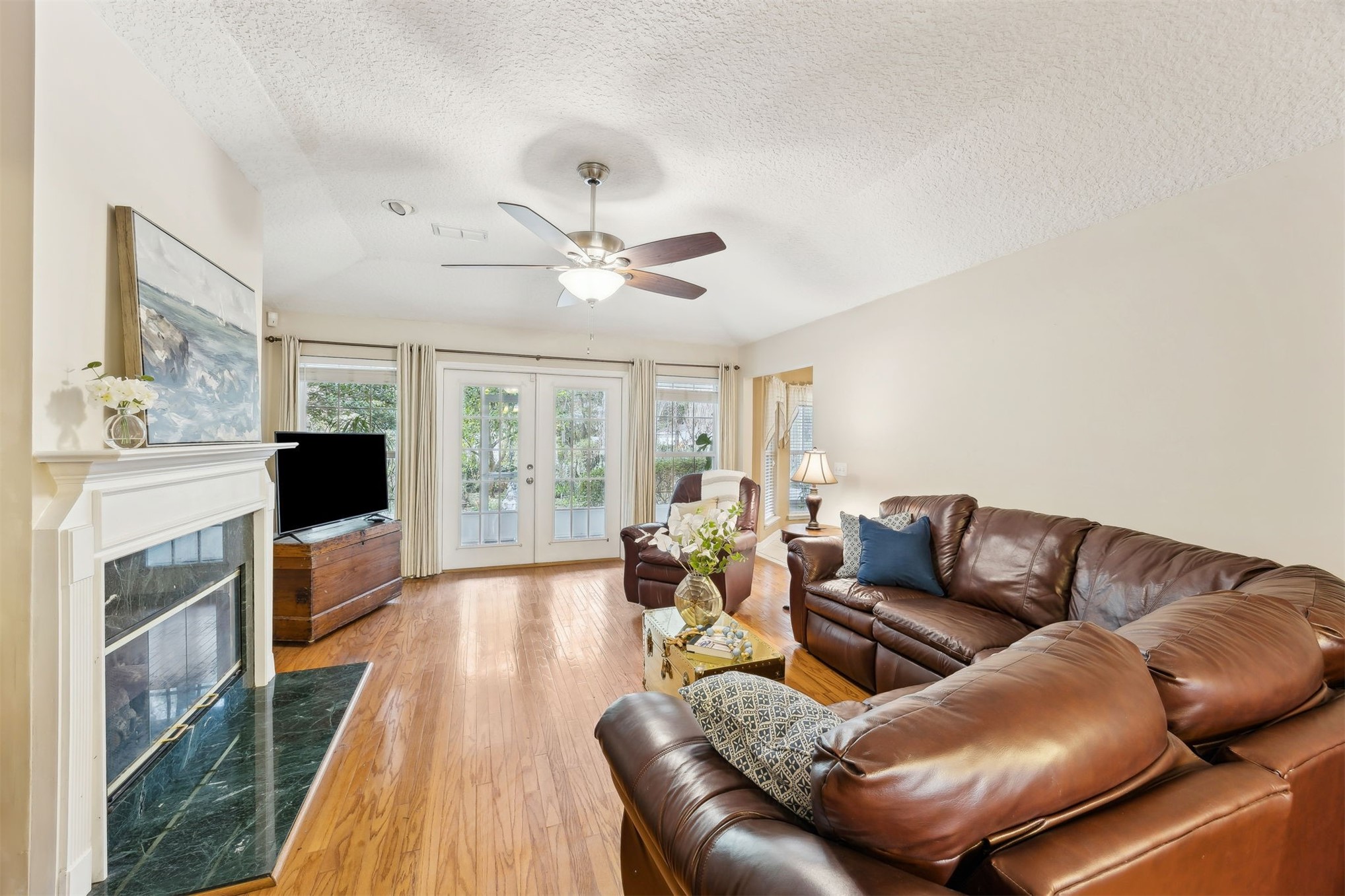 86341 Meadowfield Bluffs Road Yulee, FL 32097 - Photo 14 of 68 a living room with furniture fireplace and flat screen tv